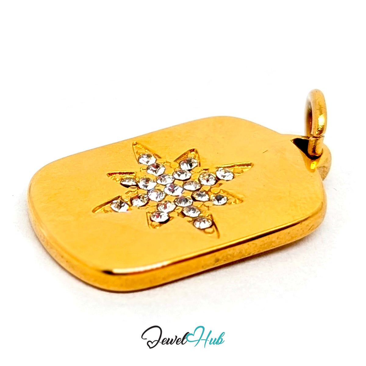 Close-up of the gold-tone crystal star plate charm detail - JewelHub