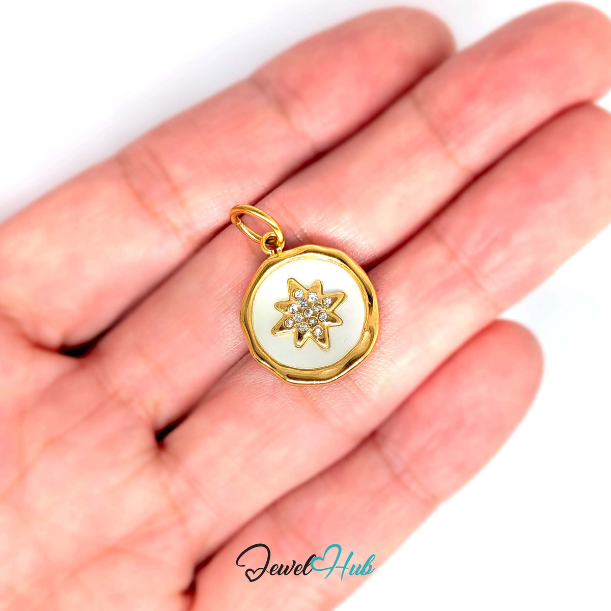White star round charm held in a hand to show its size - JewelHub