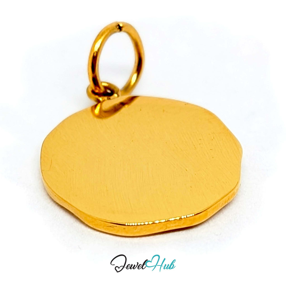 Close-up of the gold-tone white star round charm detail - JewelHub