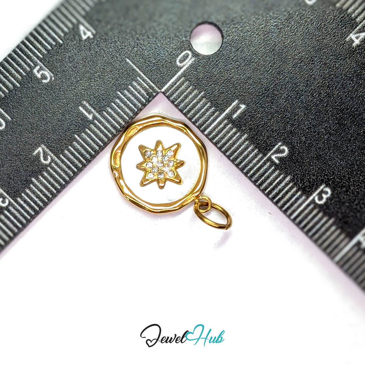 White star round charm measured against a ruler at 16.2mm wide by 19.6mm tall - JewelHub