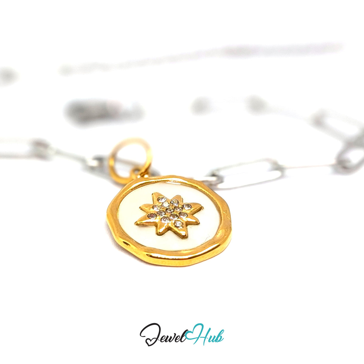 Gold-tone white star round charm styled on a silver paperclip chain bracelet for a two-tone look - JewelHub