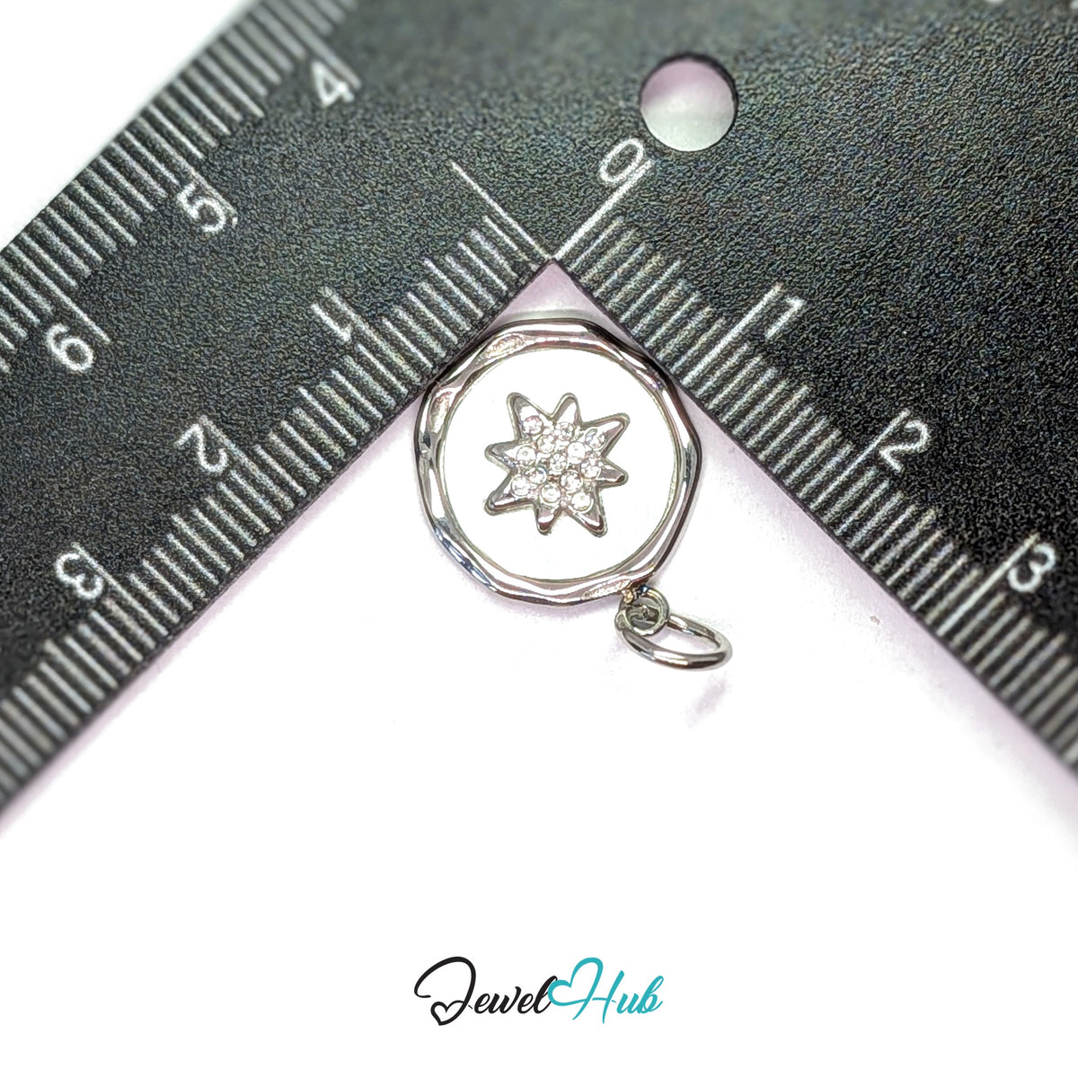 White star round charm measured against a ruler at 16.2mm wide by 19.6mm tall - JewelHub