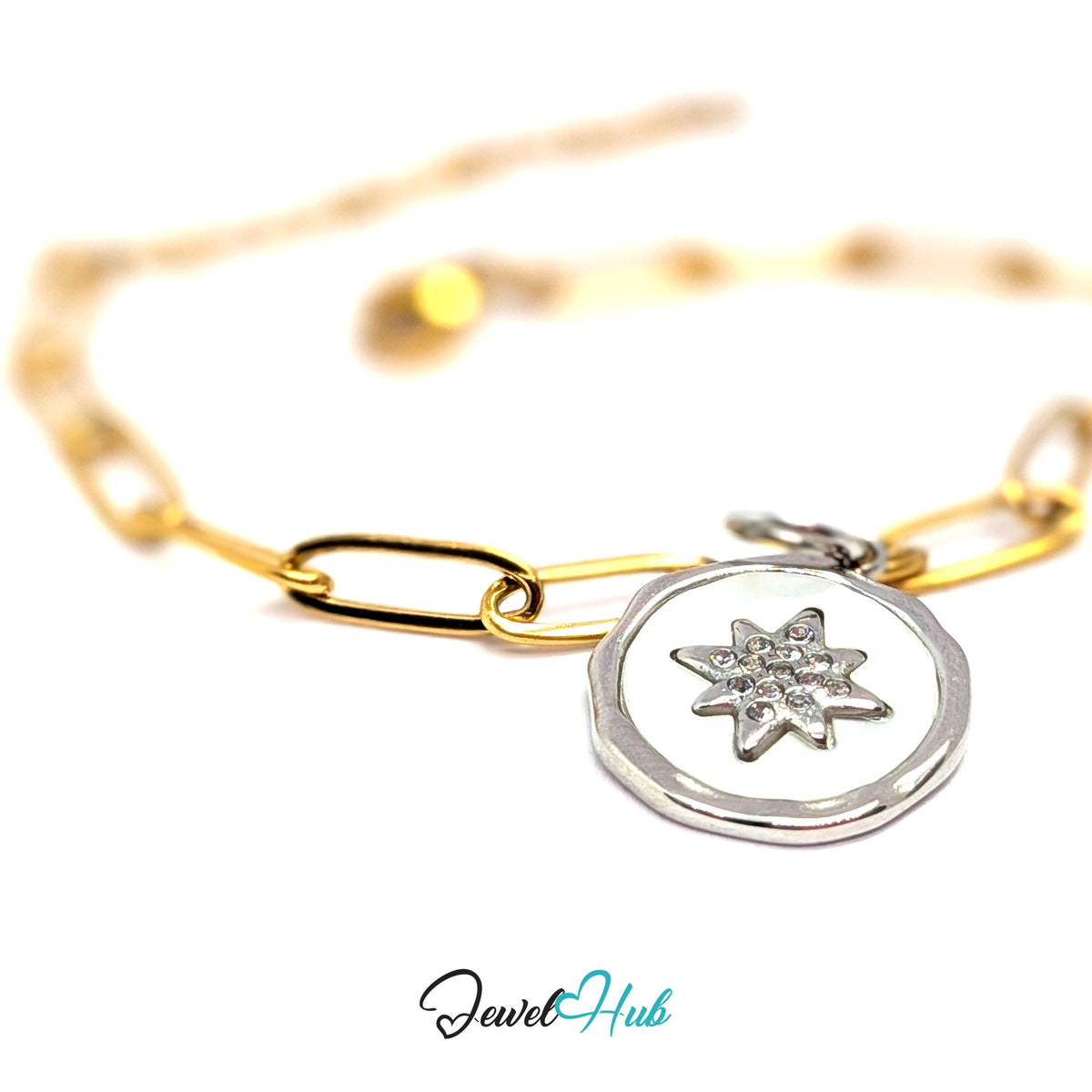 Silver-tone white star round charm styled on a gold paperclip chain bracelet for a two-tone look - JewelHub