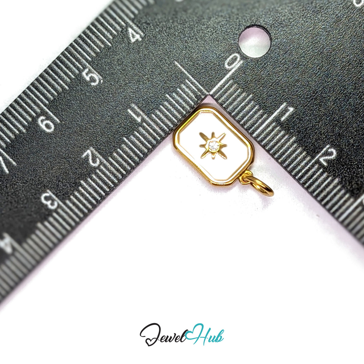White star tag charm measured against a ruler at 10mm wide by 15.6mm tall - JewelHub