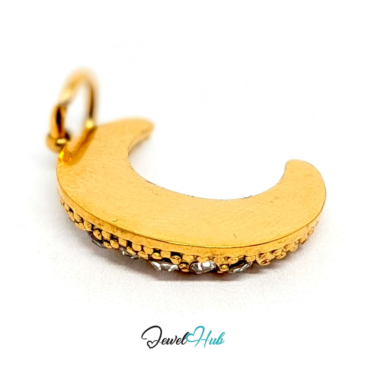 Close-up of the gold-tone crystal moon charm detail - JewelHub