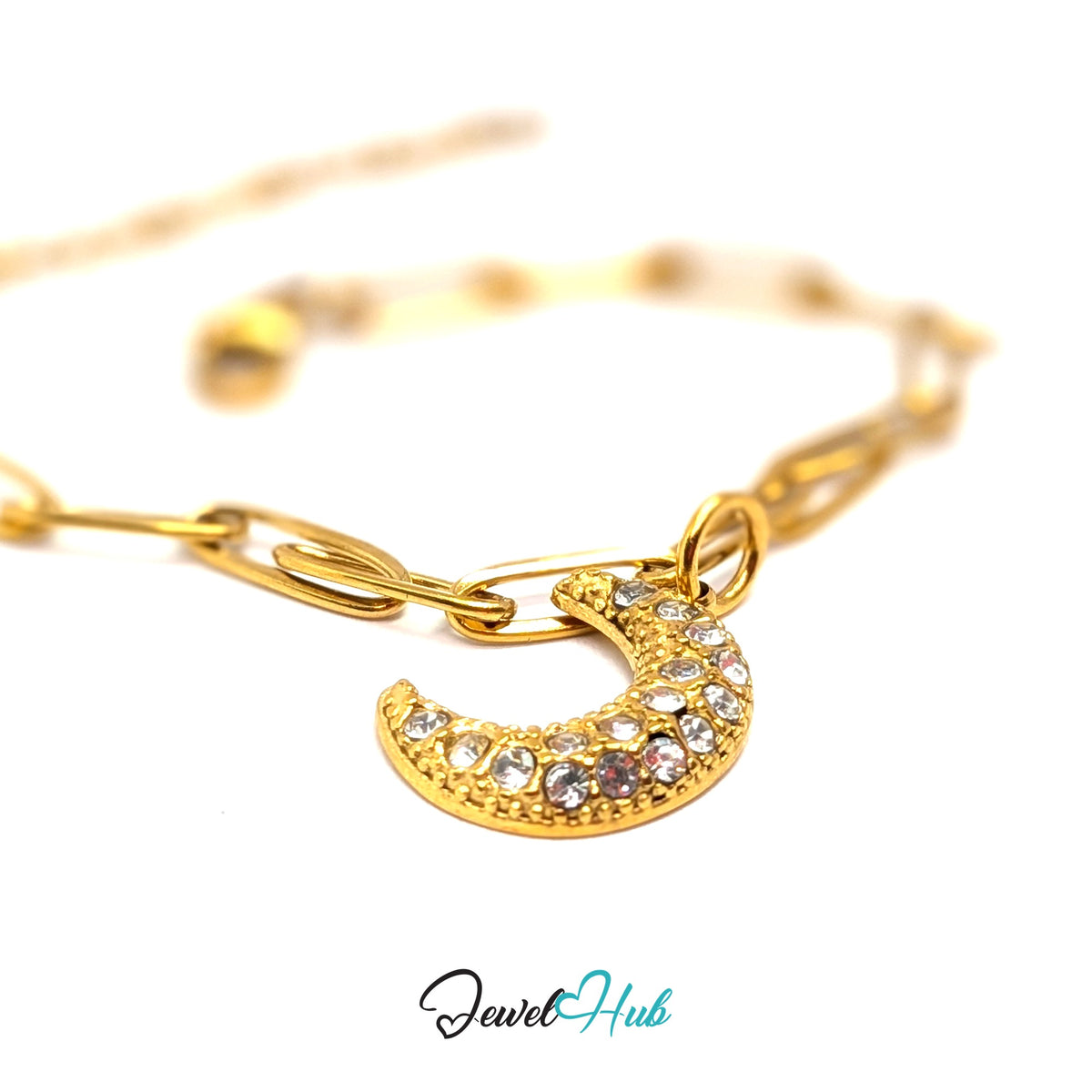 Gold-tone crystal moon charm styled on a gold paperclip chain bracelet - JewelHub
