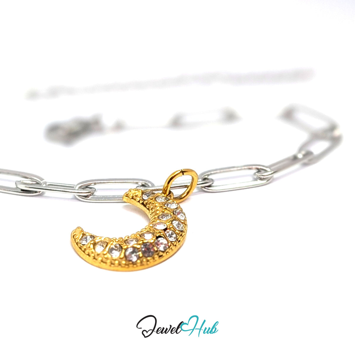 Gold-tone crystal moon charm styled on a silver paperclip chain bracelet for a two-tone look - JewelHub