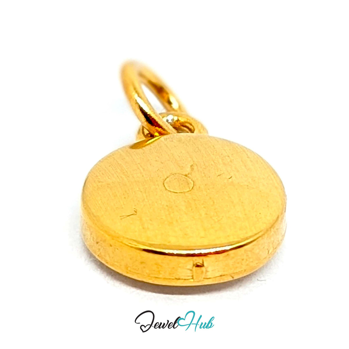Close-up of the gold-tone white sun charm detail - JewelHub