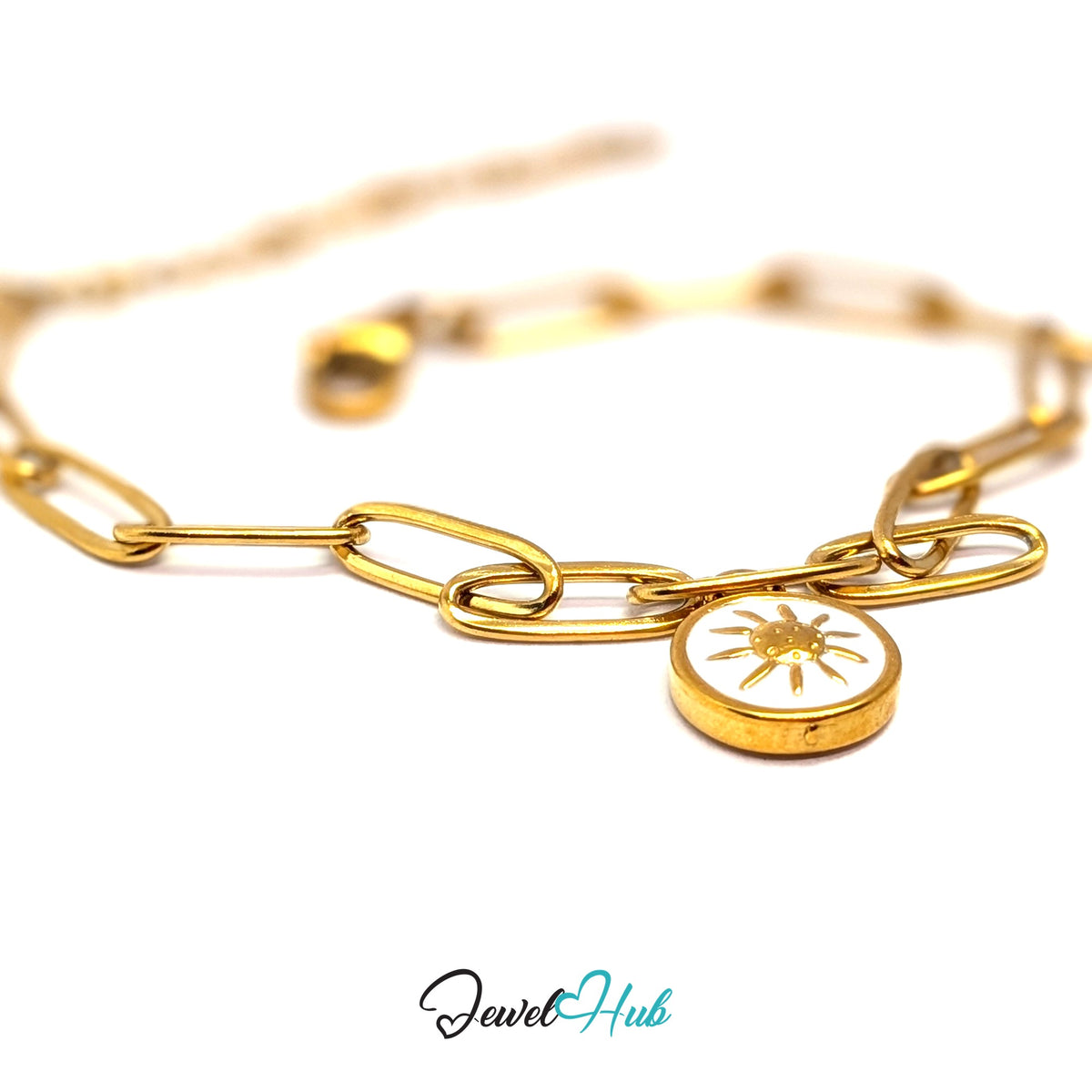 Gold-tone white sun charm styled on a gold paperclip chain bracelet - JewelHub