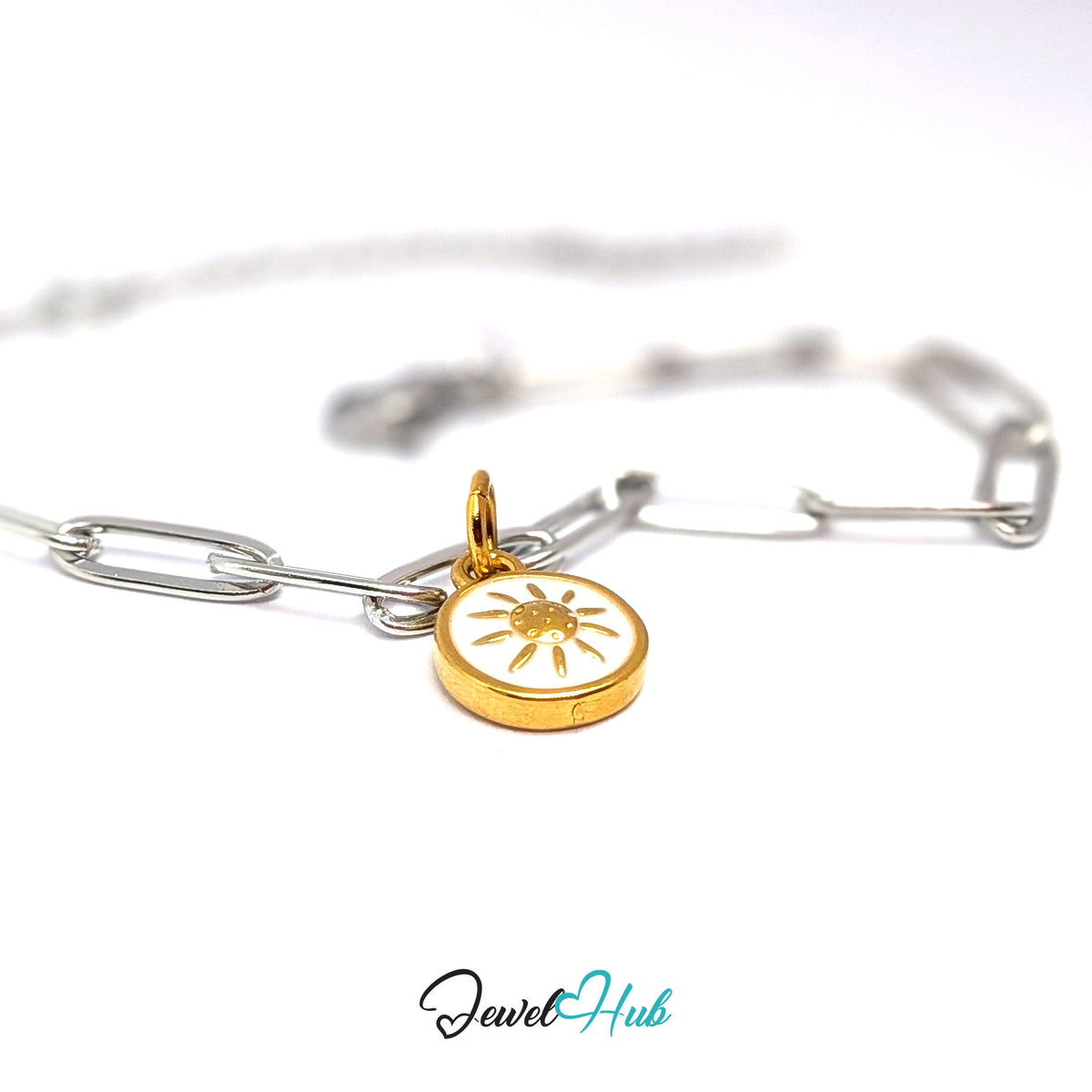 Gold-tone white sun charm styled on a silver paperclip chain bracelet for a two-tone look - JewelHub