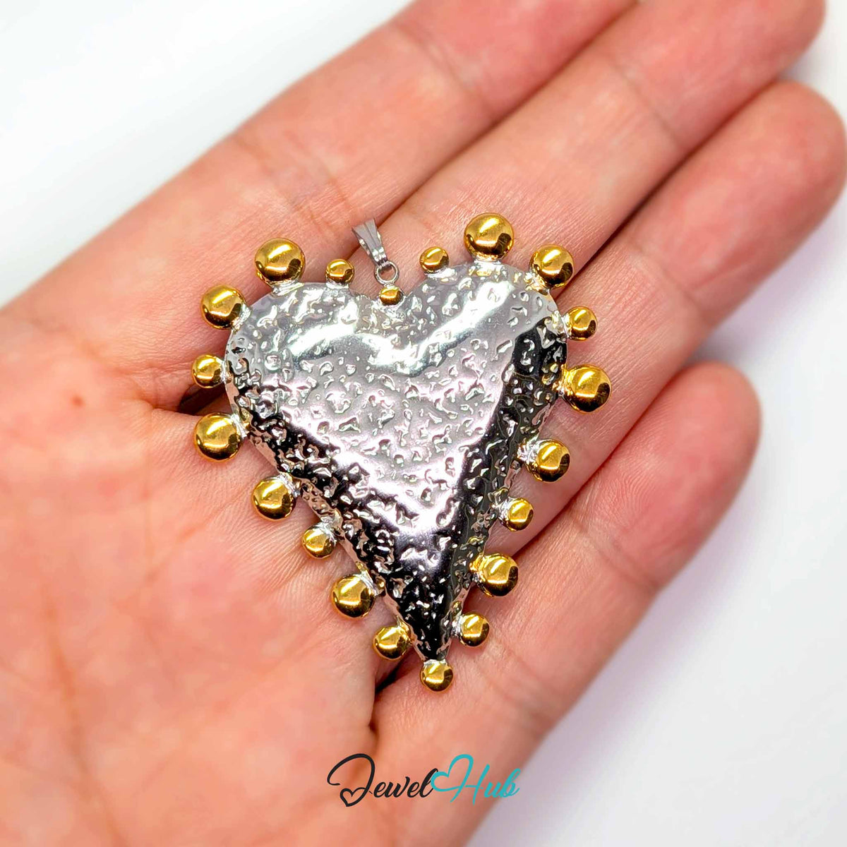 Giant Dotted Heart pendant in DuoTone stainless steel - held in the hand to show size - JewelHub