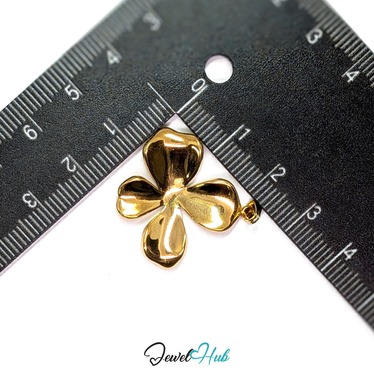 Gold Wavy Four Petal Flower pendant in gold-tone stainless steel - measurement with ruler - JewelHub
