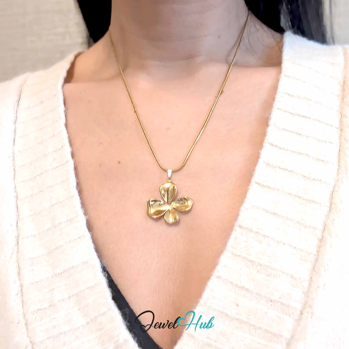 Gold Wavy Four Petal Flower pendant in gold-tone stainless steel - worn on the neck - JewelHub