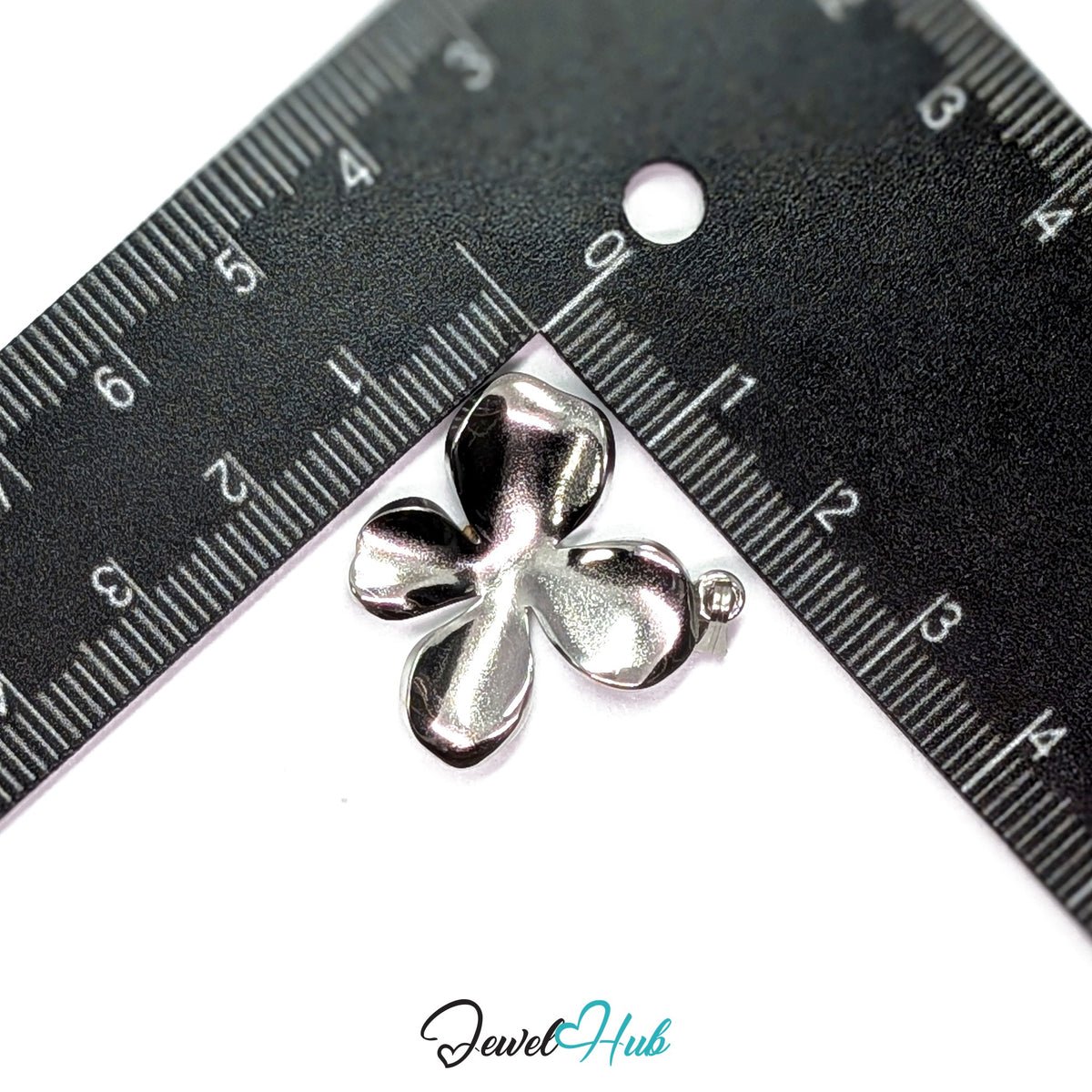 Silver Wavy Four Petal Flower pendant in silver-tone stainless steel - measurement with ruler - JewelHub