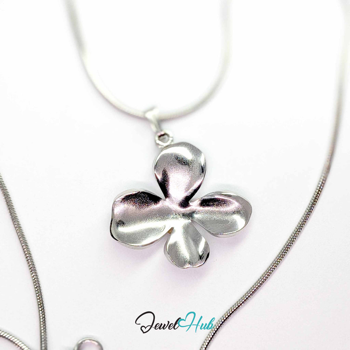 Silver Wavy Four Petal Flower pendant in silver-tone stainless steel - on a silver-tone stainless steel chain - JewelHub