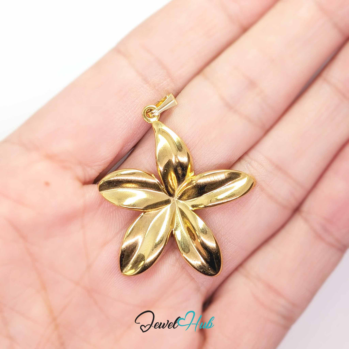 Gold Five Long Petal Flower pendant in gold-tone stainless steel - held in the hand to show size - JewelHub