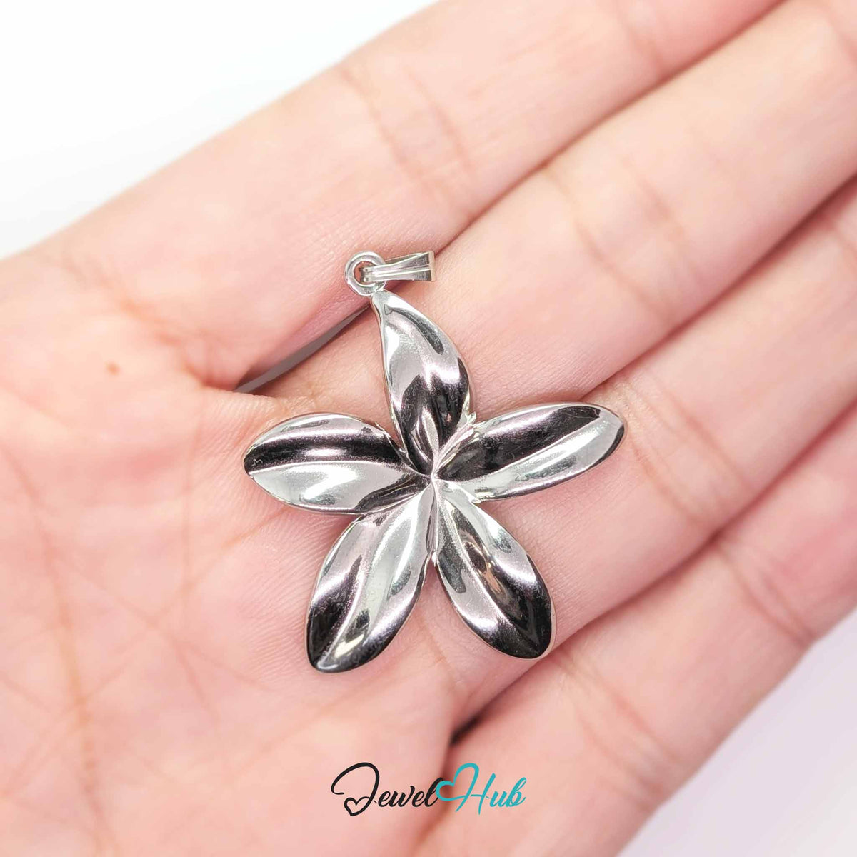 Silver Five Long Petal Flower pendant in silver-tone stainless steel - held in the hand to show size - JewelHub
