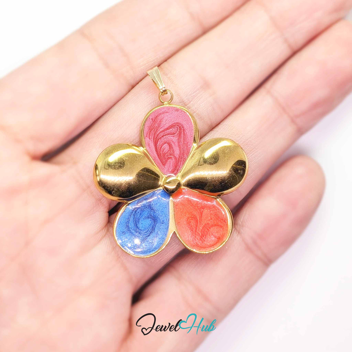 Pink, Coral and Blue Enamel Flower pendant in gold-tone stainless steel - held in the hand to show size - JewelHub