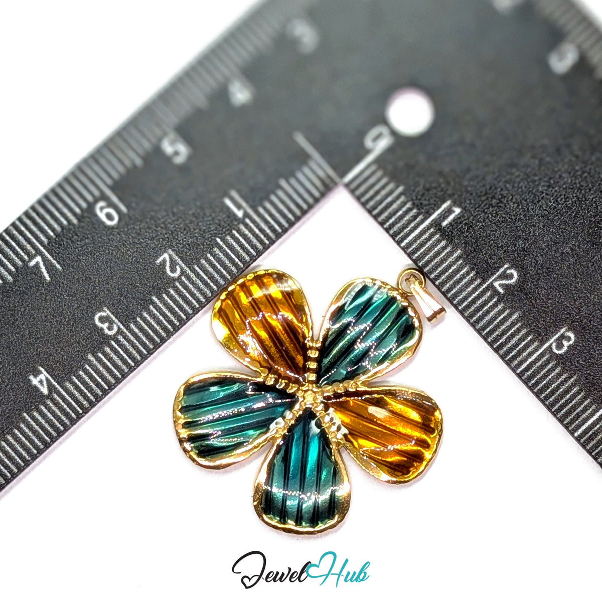 Teal and Amber Enamel Flower pendant in gold-tone stainless steel - measurement with ruler - JewelHub