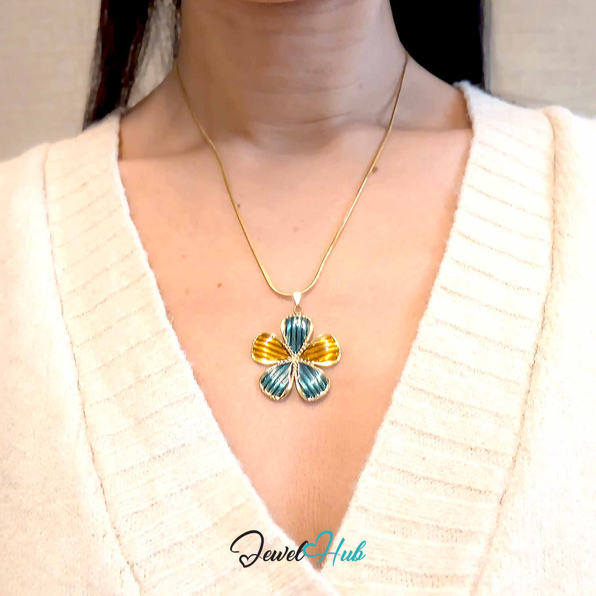 Teal and Amber Enamel Flower pendant in gold-tone stainless steel - worn on the neck - JewelHub