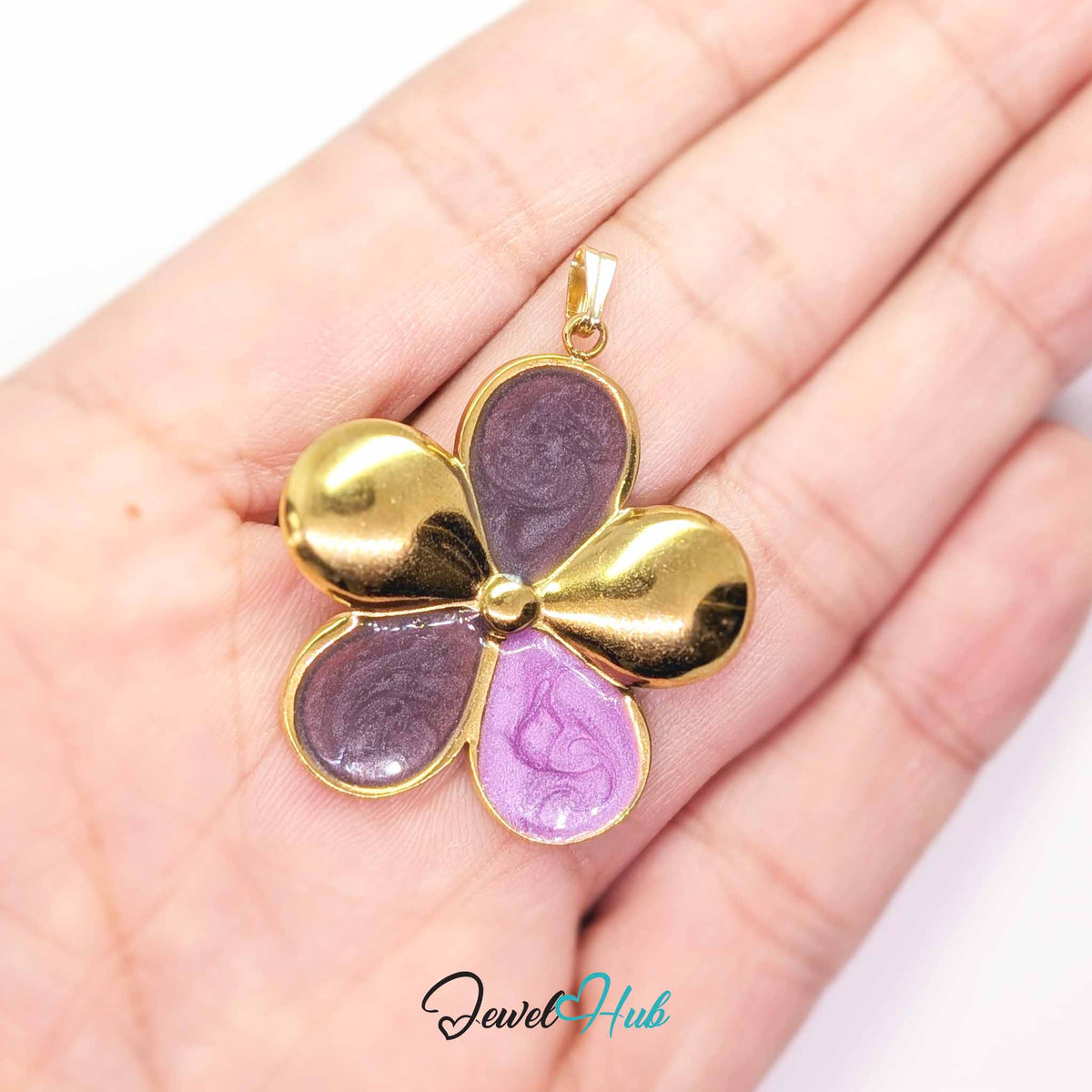 Plum and Lilac Enamel Flower pendant in gold-tone stainless steel - held in the hand to show size - JewelHub