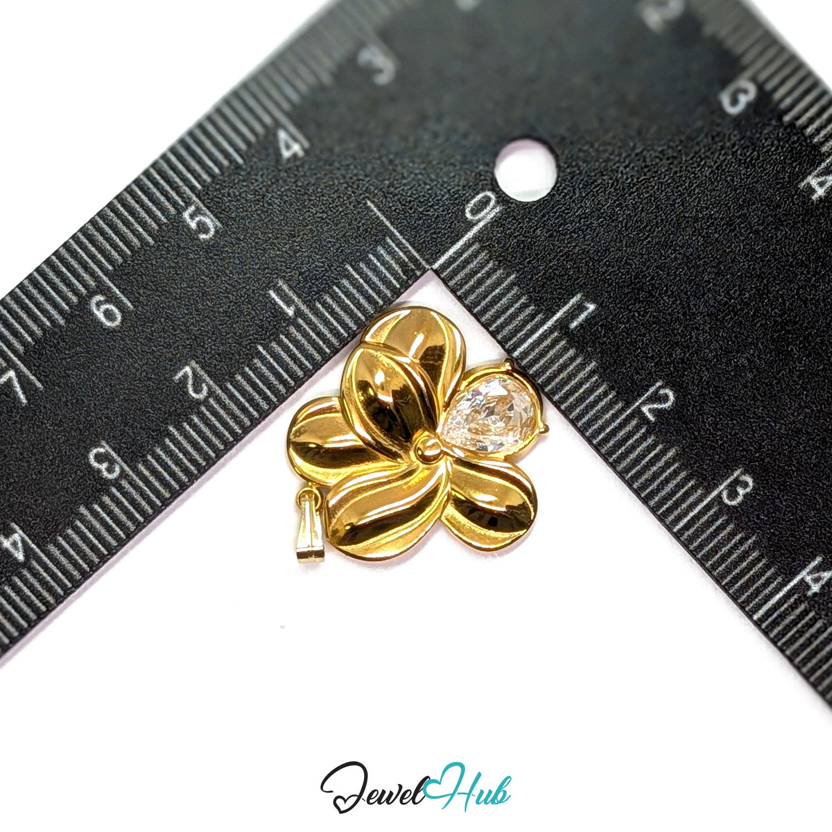 Gold Crystal Flower pendant in gold-tone stainless steel - measurement with ruler - JewelHub