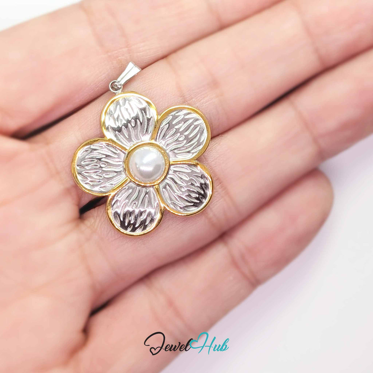 Pearl Flower pendant in DuoTone stainless steel - held in the hand to show size - JewelHub