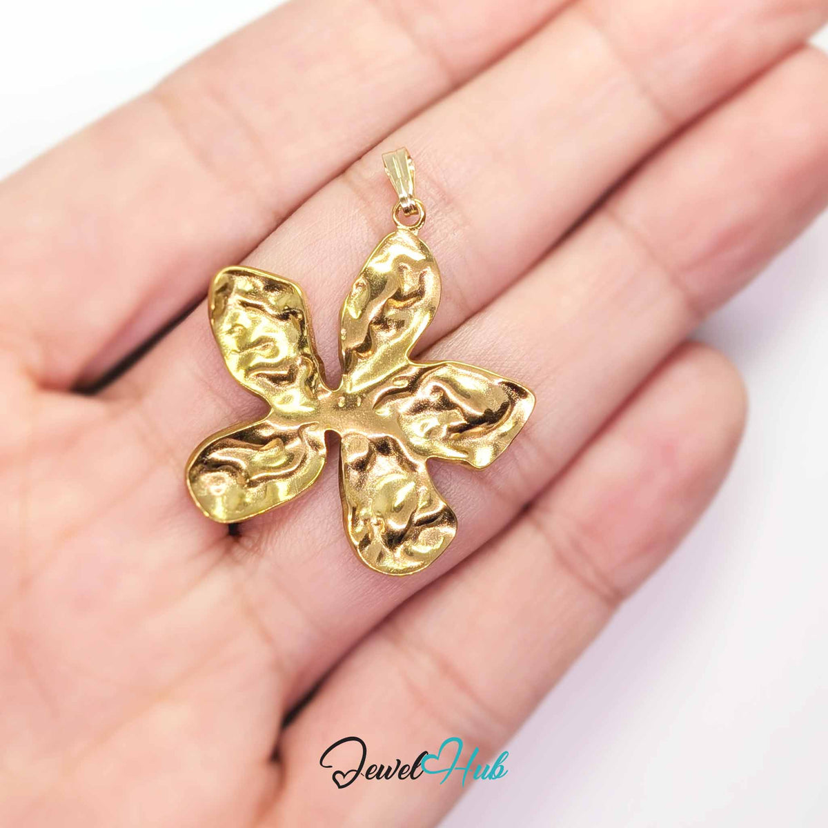 Gold Organic Petal Flower pendant in gold-tone stainless steel - held in the hand to show size - JewelHub