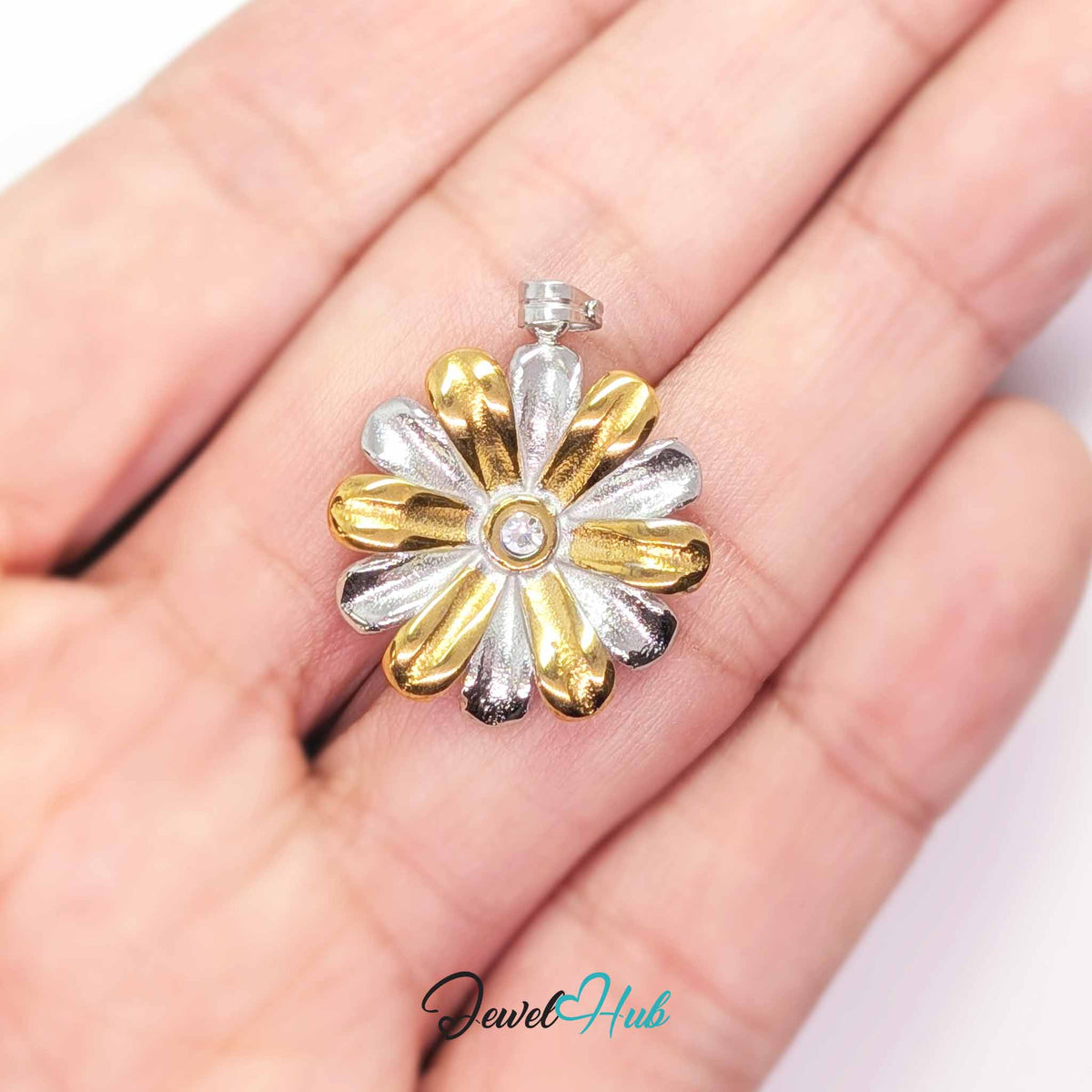 Crystal Daisy pendant in DuoTone stainless steel - held in the hand to show size - JewelHub