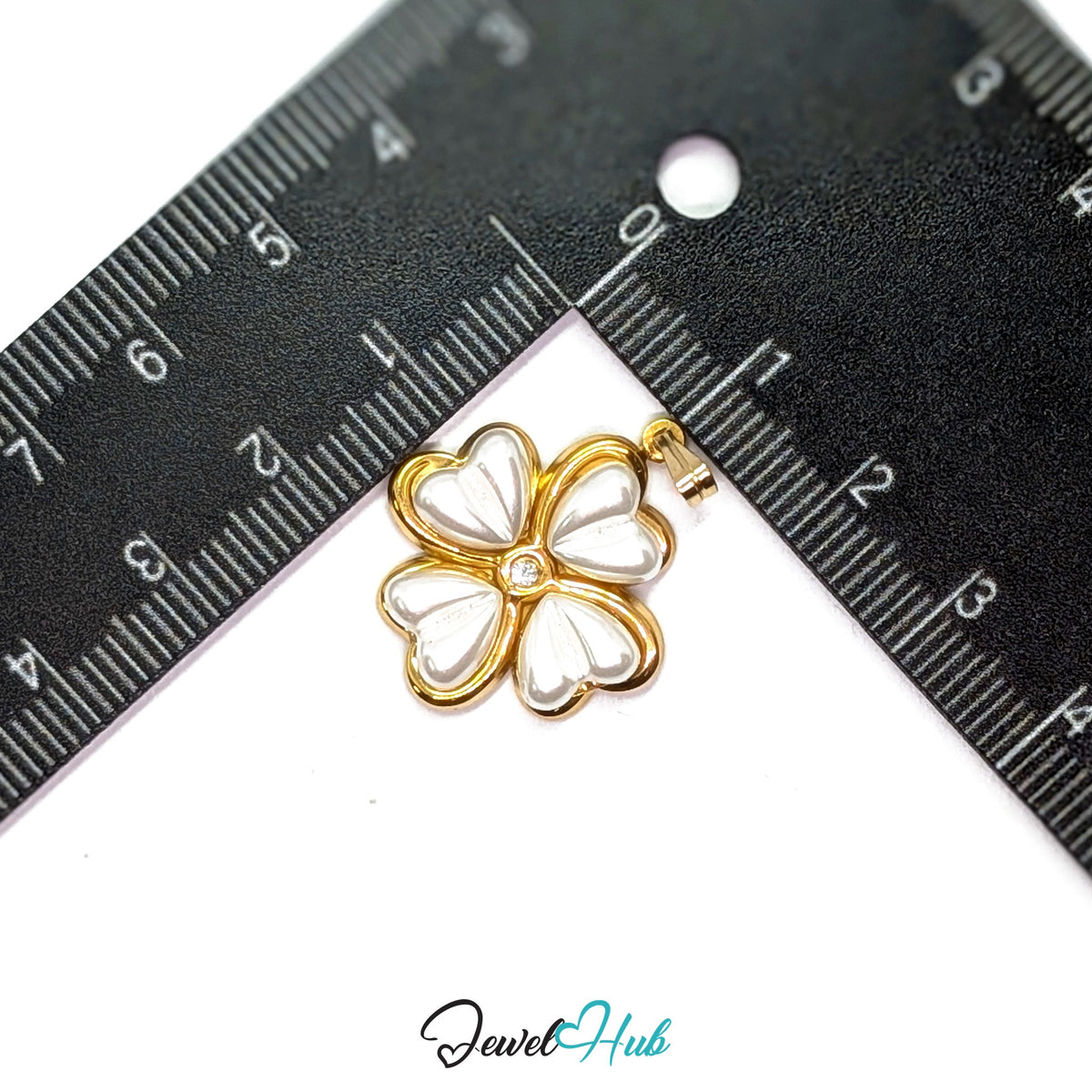 Pearl Four Leaf Clover pendant in gold-tone stainless steel - measurement with ruler - JewelHub