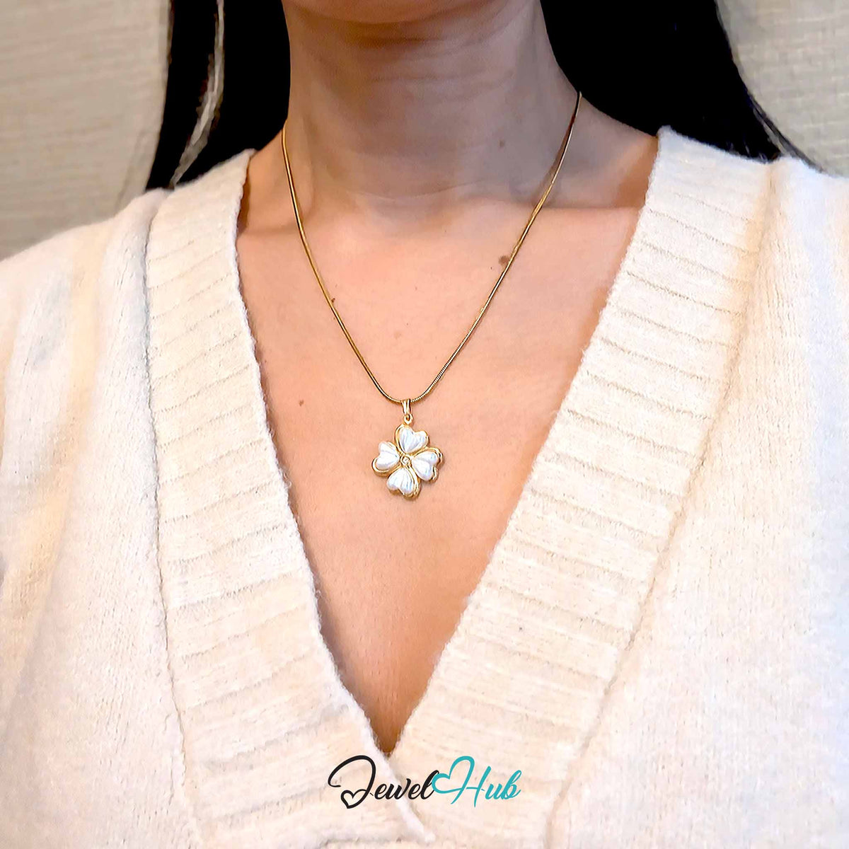 Pearl Four Leaf Clover pendant in gold-tone stainless steel - worn on the neck - JewelHub