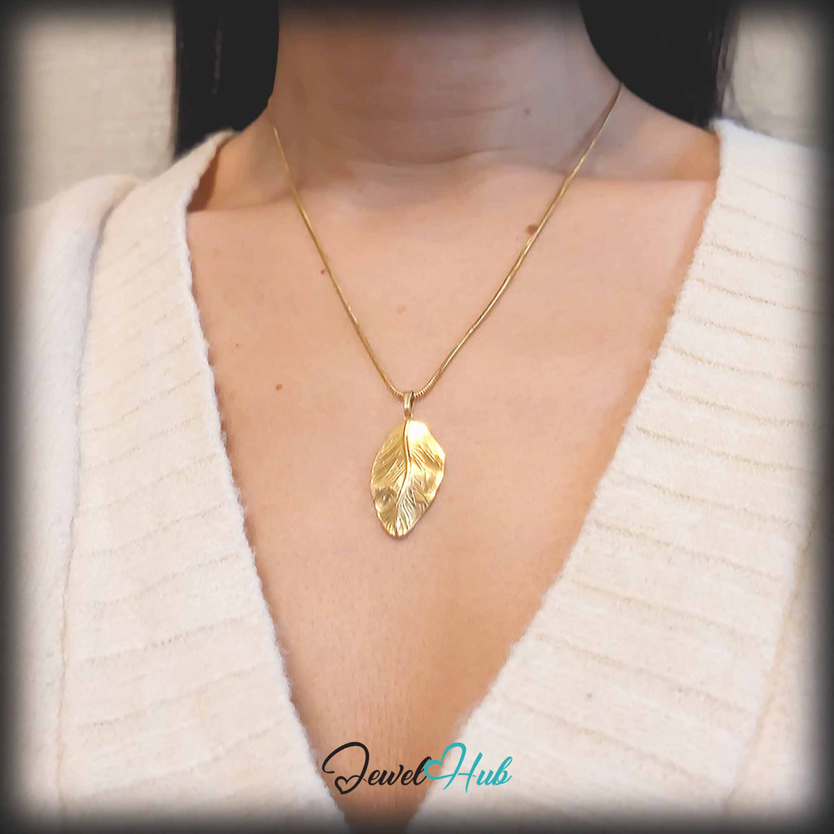 Gold Dewdrop Leaf pendant in gold-tone stainless steel - worn on the neck - JewelHub