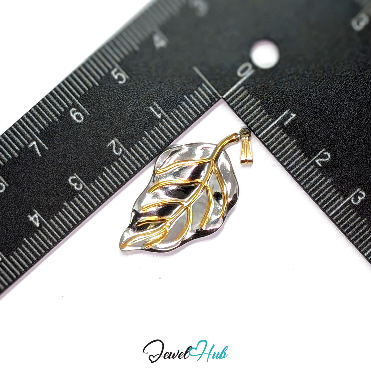Leaf pendant in DuoTone stainless steel - measurement with ruler - JewelHub