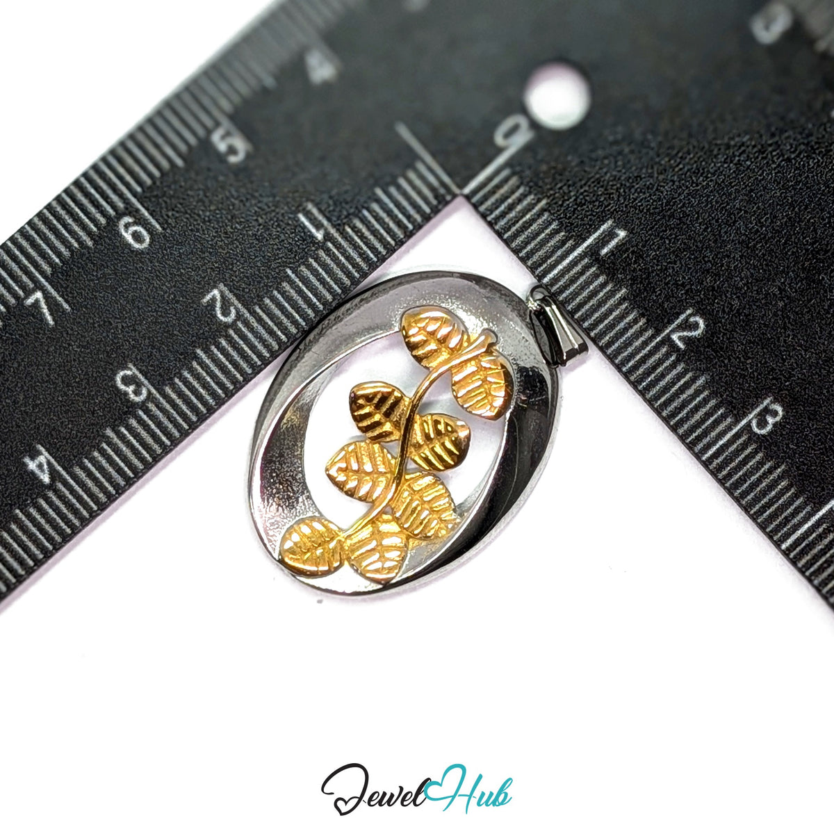 Oval Branch pendant in DuoTone stainless steel - measurement with ruler - JewelHub
