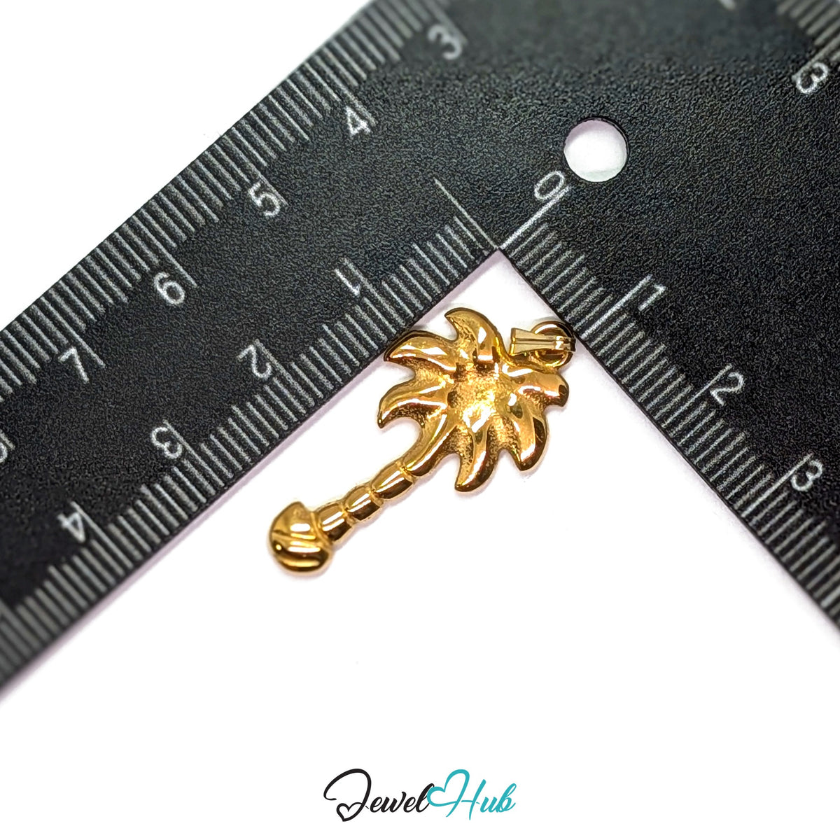 Gold Palm Tree pendant in gold-tone stainless steel - measurement with ruler - JewelHub