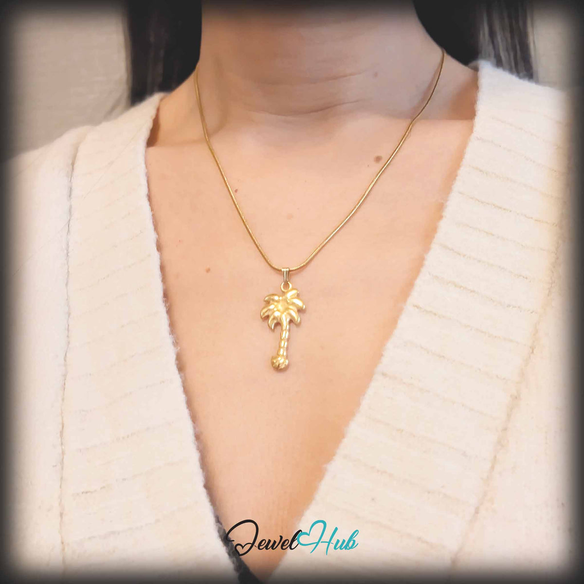 Gold Palm Tree pendant in gold-tone stainless steel - worn on the neck - JewelHub