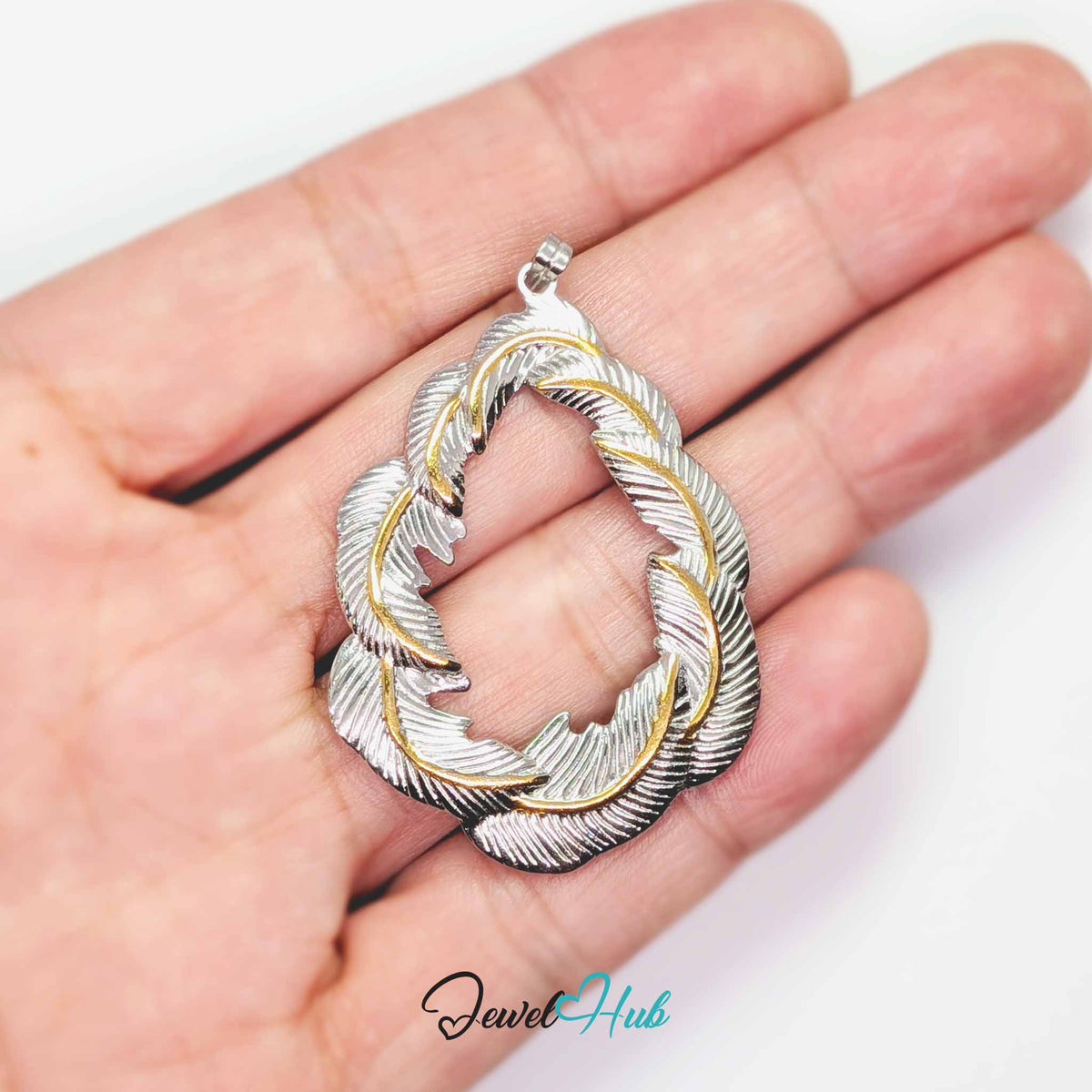 Leaf Wreath pendant in DuoTone stainless steel - held in the hand to show size - JewelHub