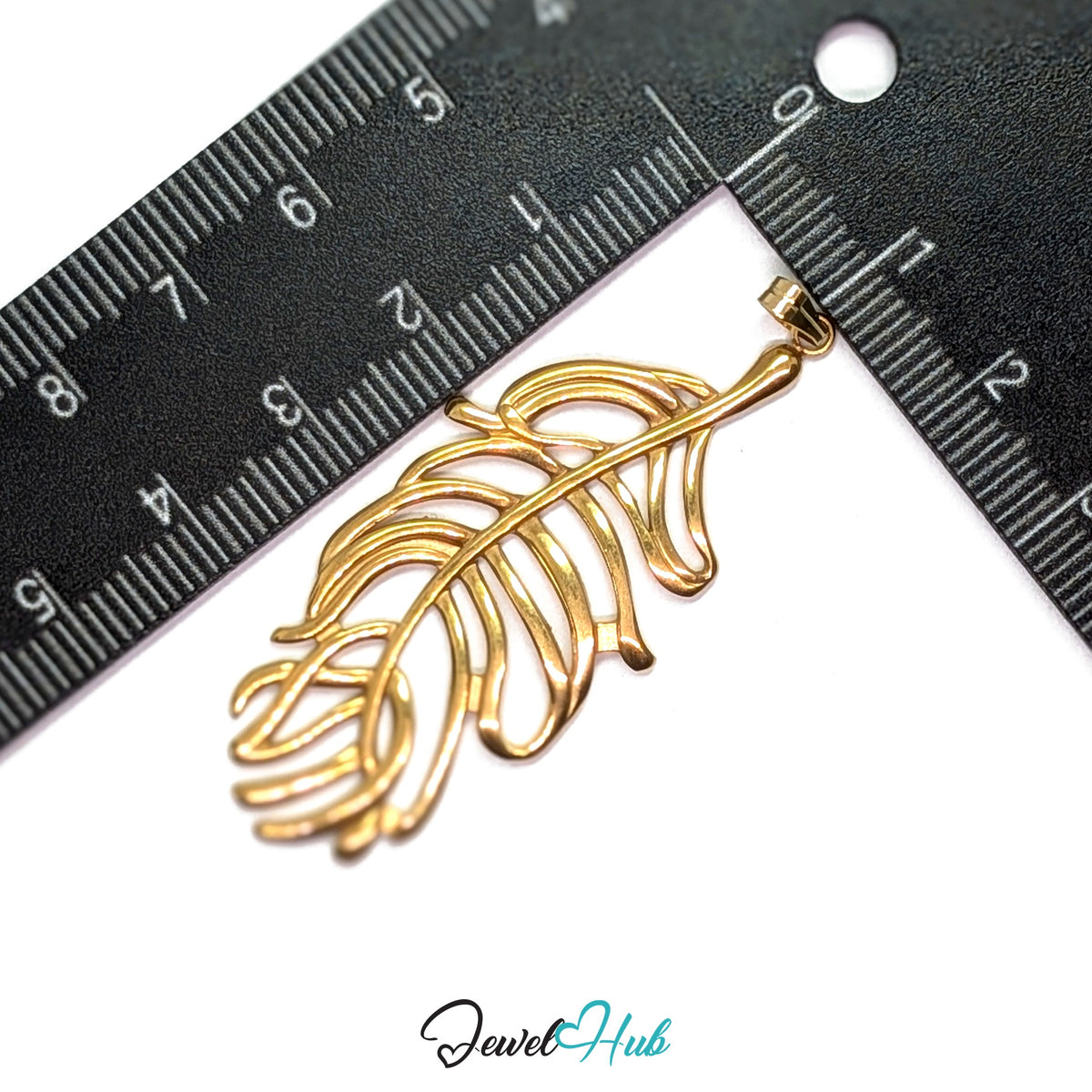 Gold Feather Leaf pendant in gold-tone stainless steel - measurement with ruler - JewelHub