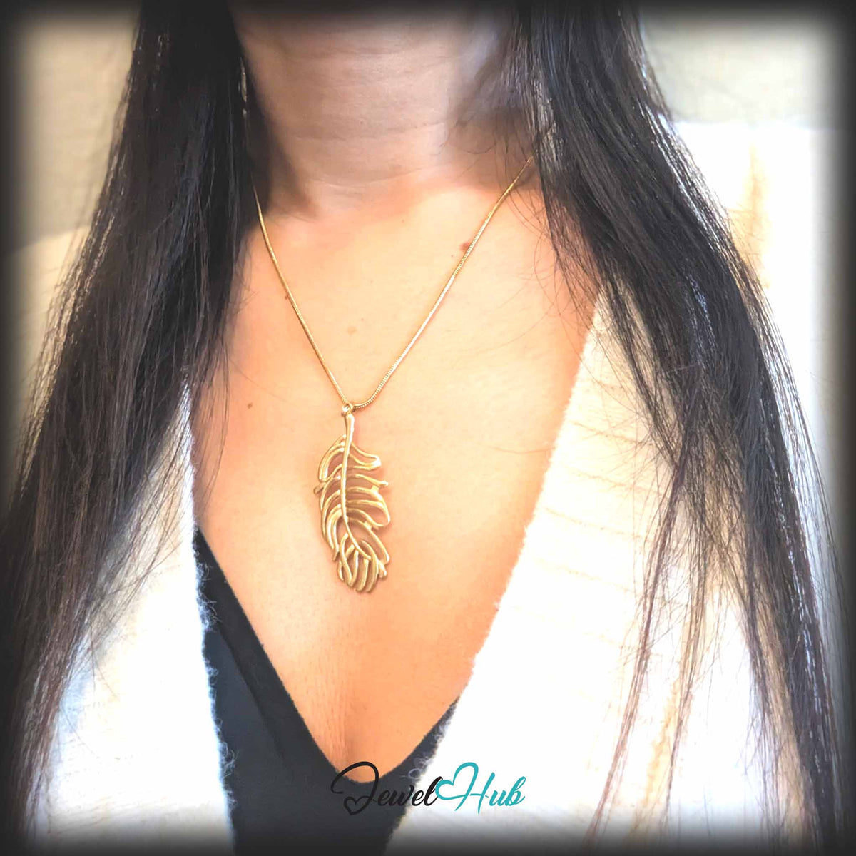 Gold Feather Leaf pendant in gold-tone stainless steel - worn on the neck - JewelHub