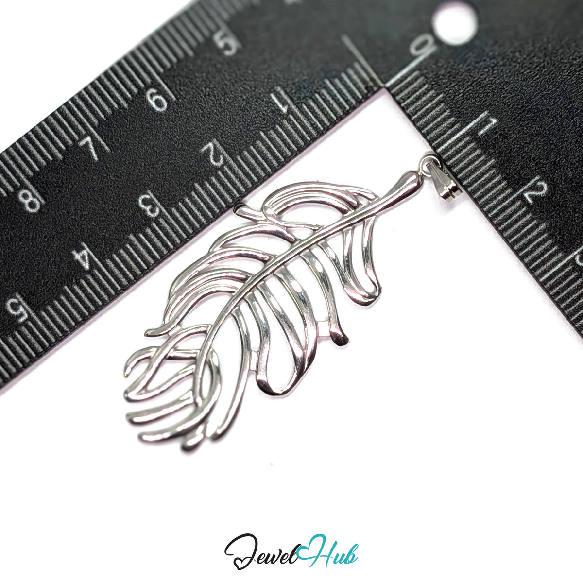 Silver Feather Leaf pendant in silver-tone stainless steel - measurement with ruler - JewelHub
