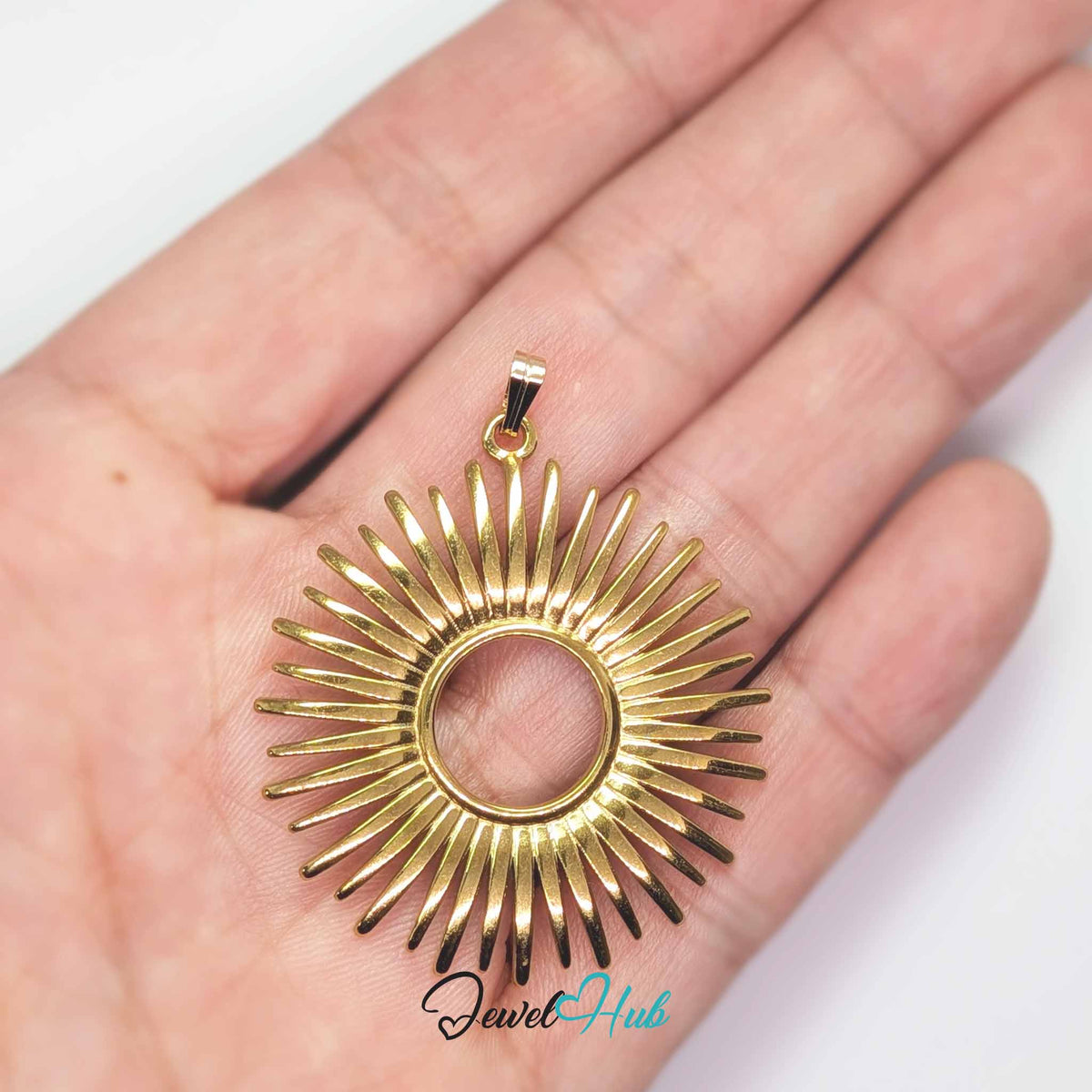 Gold Giant Sun pendant in gold-tone stainless steel - held in the hand to show size - JewelHub