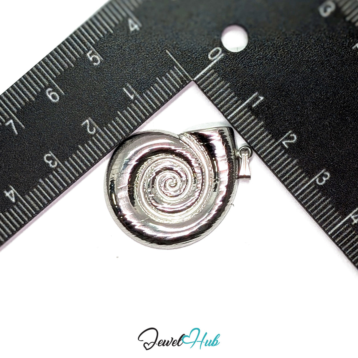 Silver Spiral Shell pendant in silver-tone stainless steel - measurement with ruler - JewelHub
