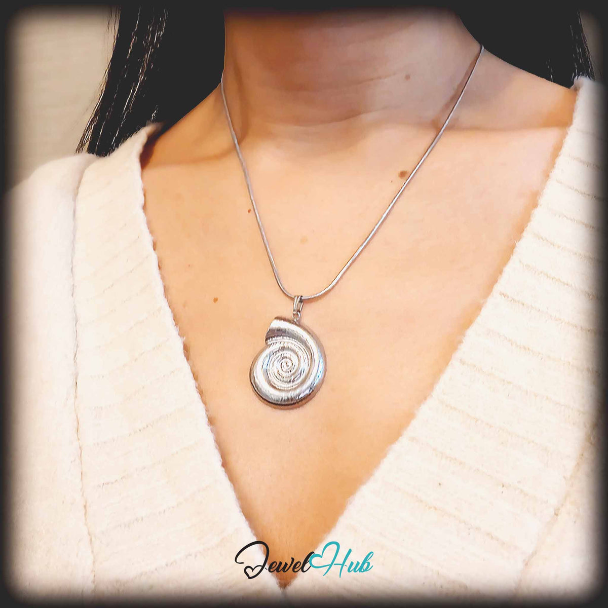 Silver Spiral Shell pendant in silver-tone stainless steel - worn on the neck - JewelHub