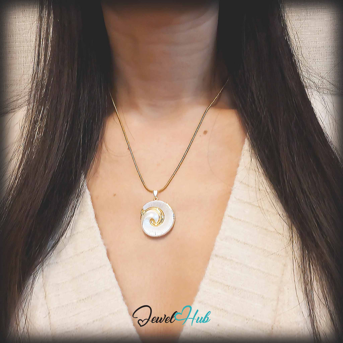 Pearl Spiral Shell pendant in gold-tone stainless steel - worn on the neck - JewelHub