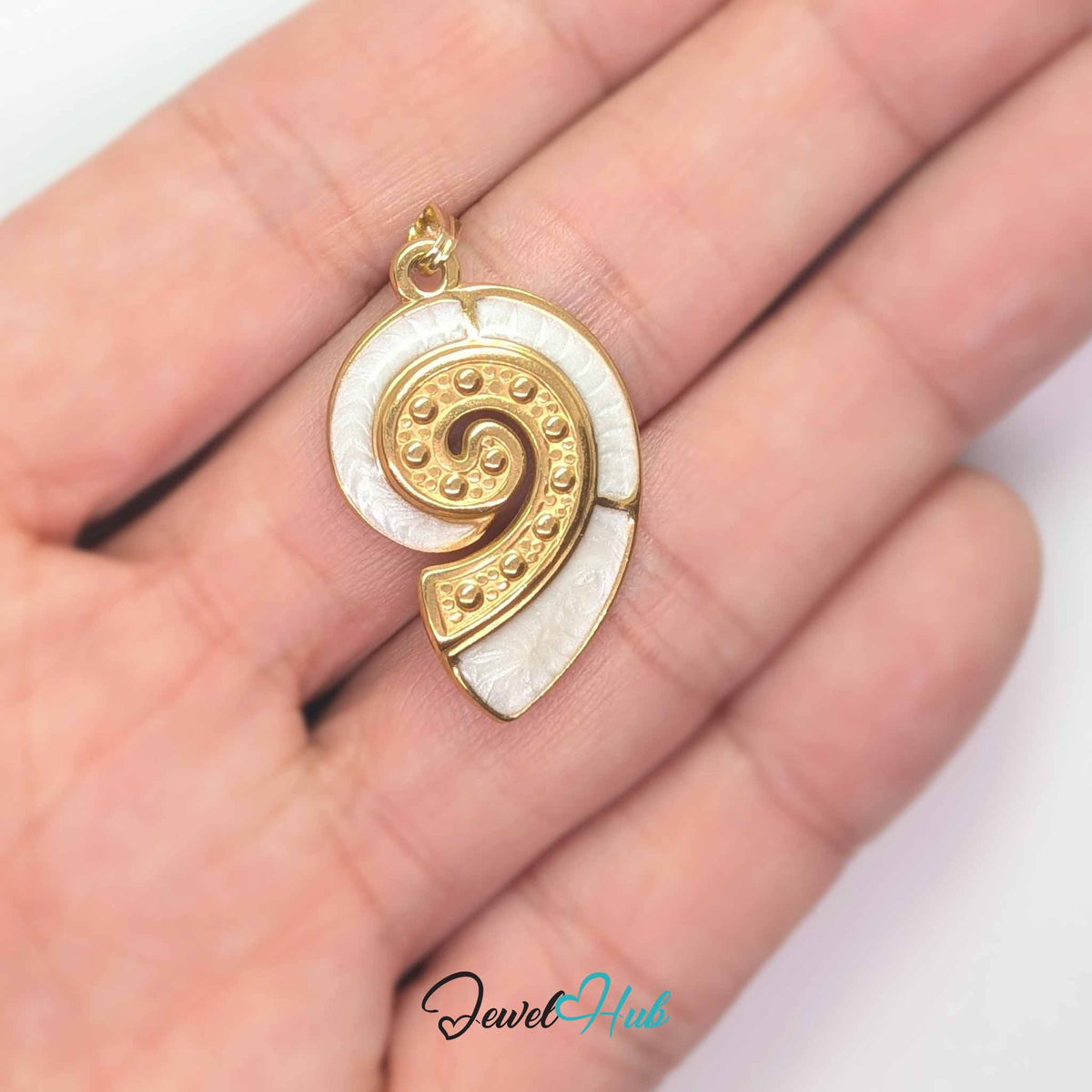 Pearl Nautilus Shell pendant in gold-tone stainless steel - held in the hand to show size - JewelHub