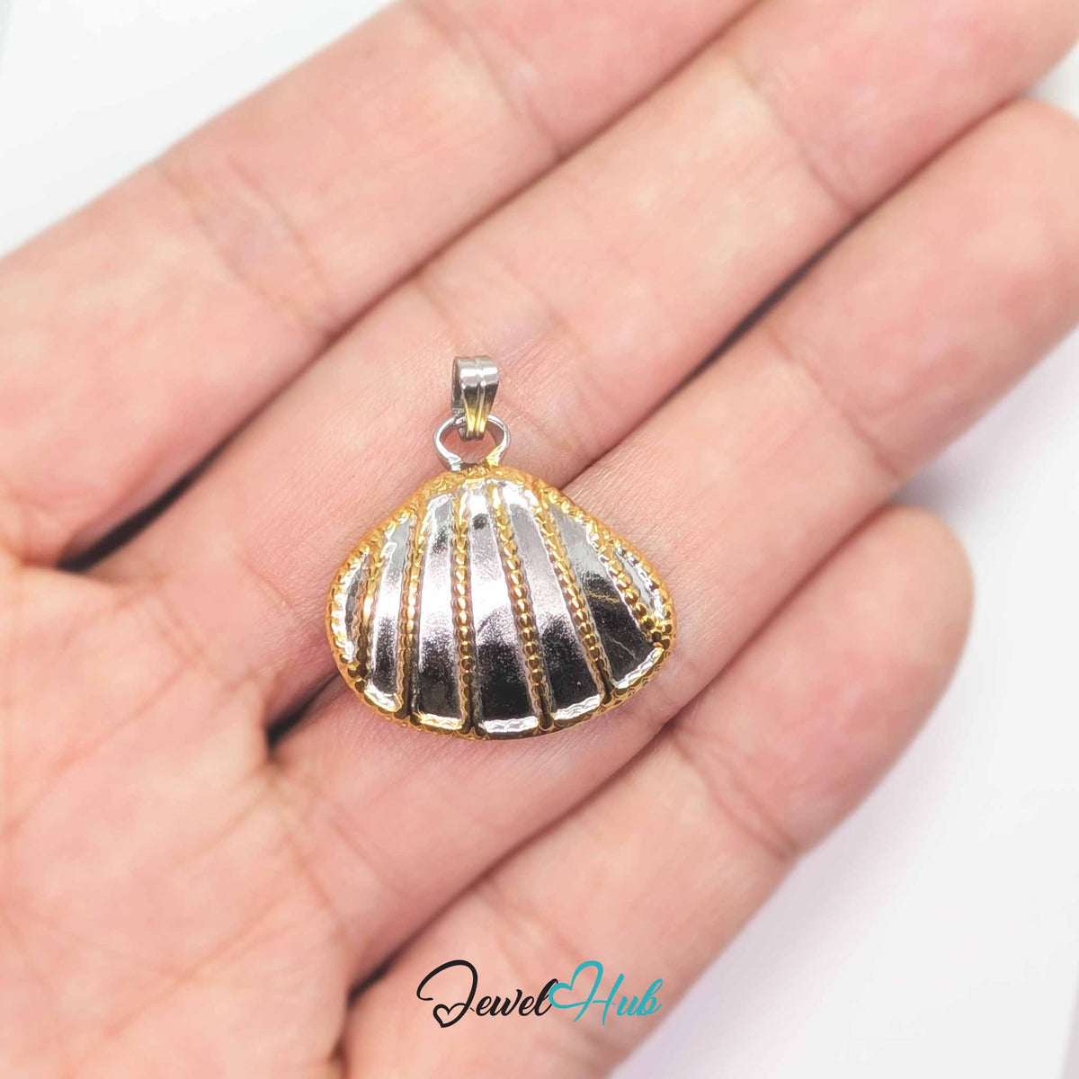 Scallop Shell pendant in DuoTone stainless steel - held in the hand to show size - JewelHub