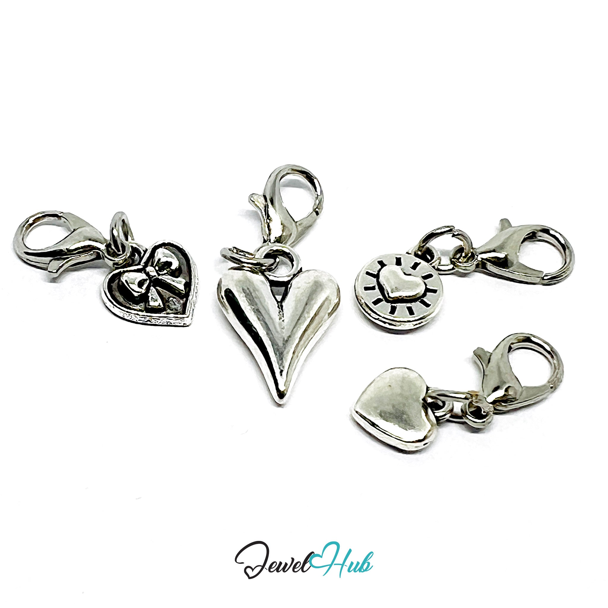 Set of silver heart-shaped charms with lobster clasps on a white background, branded 'Jewel Hub'.