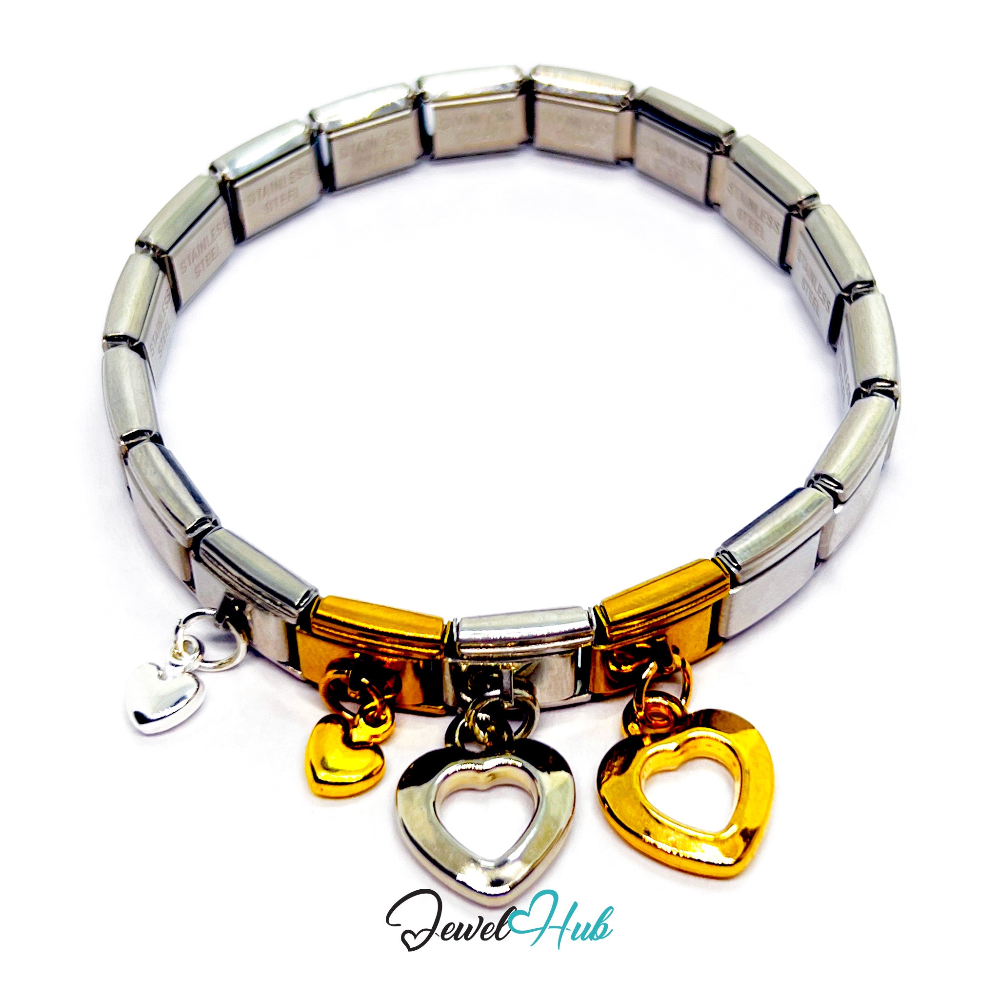 Silver and gold bracelet with heart-shaped charms on a white background