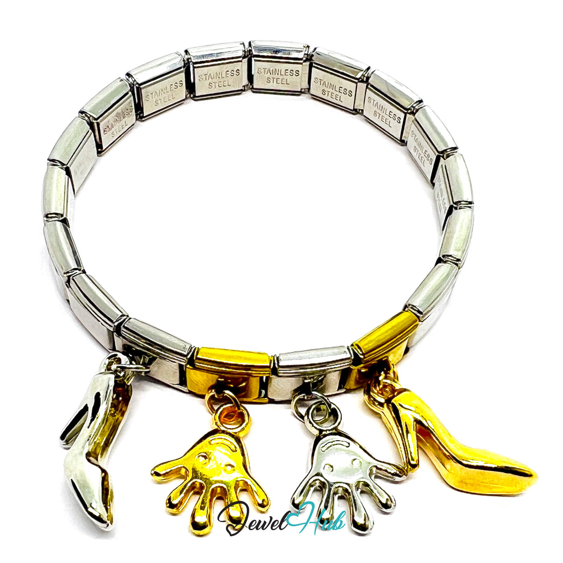 Silver and gold bracelet with charms on a white background