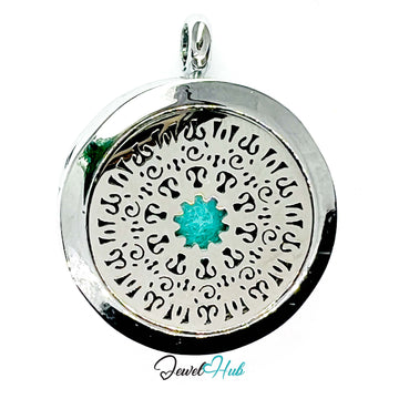 Silver pendant with intricate designs and a turquoise stone on a white background, branded 'Jewel Hub'.